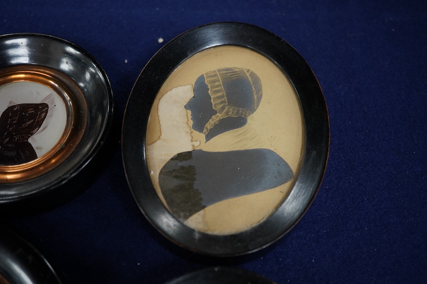 Four mid 19th century Irish hand painted silhouette portraits to include two of Sarah Woods, neé Walsh, wife of James Woods of Kilwarlin and one of Sarah Lawton, wife of Samuel Moss, largest 9.5 x 6.5cm, each framed